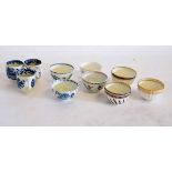 Collection of English porcelain tea bowls and cups, decorated with blue printed and polychrome