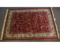 20th century Kashmir rug, "Tree of Life" design to a red ground, 240 x 160cms