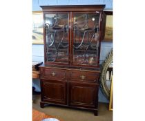 Georgian mahogany secretaire bookcase with two glazed doors and urn formed detail and fleur de lys