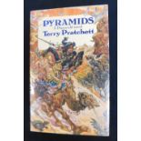 TERRY PRATCHETT: PYRAMIDS, London, Victor Gollancz, 1989, 1st edition, signed to title page,