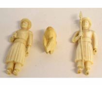 Group: two Indian carved ivory figures of soldiers, one holding a spear, 6 1/2cms tall, together