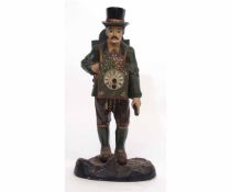 Painted base metal novelty timepiece modelled in the form of a clock seller wearing a top hat and