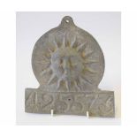 Cast lead fire mark decorated with a sun, 425573, height 18 1/2cms
