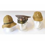 Mixed Lot: three various Soviet period hats including a peaked cap adorned with various Communist