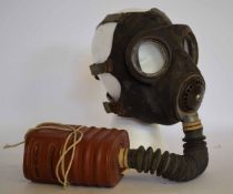 British Government issue gas mask No 4 III, B6/42 of typical black rubber form with six elastic