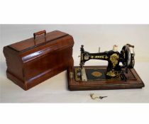Vintage walnut cased, Japanned and gilt sewing machine, Jones, 447314, 45cms long