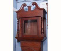 Mid-19th century mahogany longcase clock case, the hood with swan neck pediment over free-standing