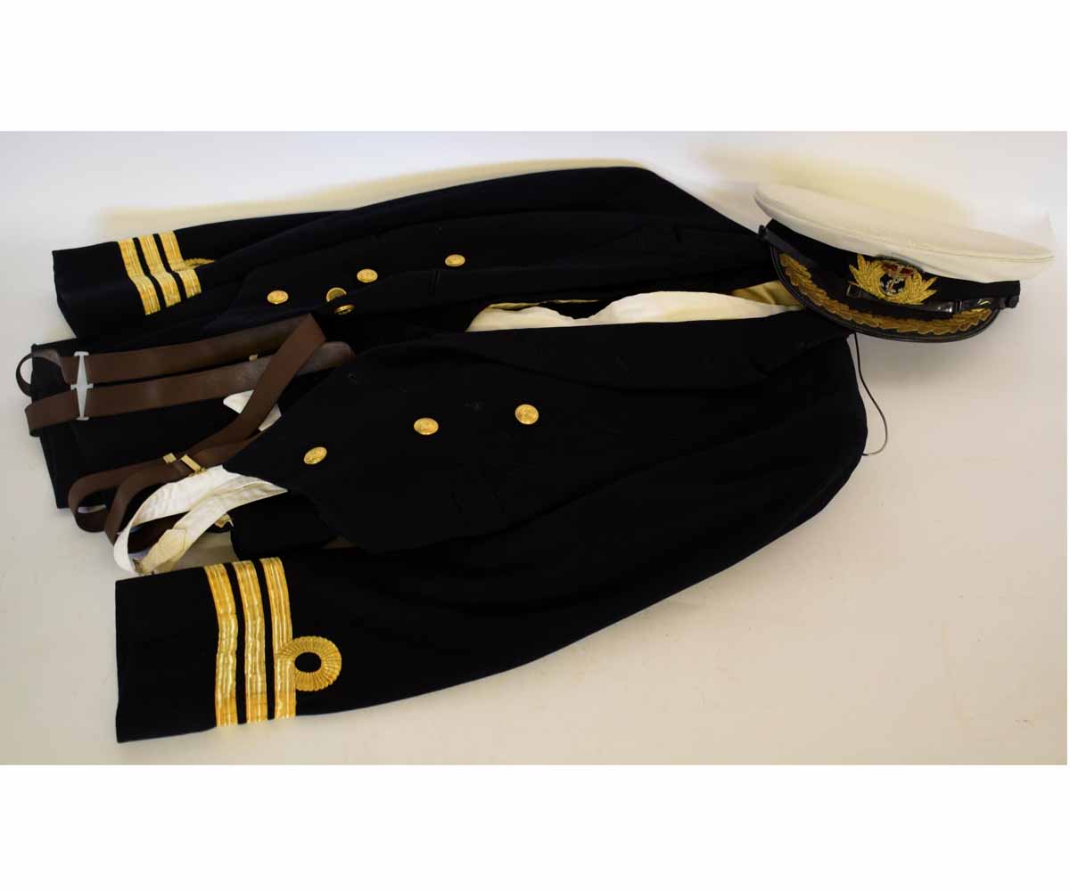 Royal Naval mess jacket together with a waistcoat, white bib waistcoat and trousers and an Officer's