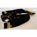 Royal Naval mess jacket together with a waistcoat, white bib waistcoat and trousers and an Officer's