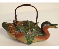 Unusual Oriental painted ceramic teapot modelled as a duck, with cane handle, (repair to beak),