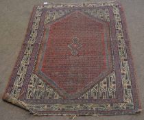 Good quality red and cream ground floor rug with a geometric border and central rust diamond