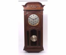 Mid-20th century walnut cased triple barrel wall clock, the case with arched and moulded pediment