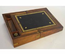 19th century walnut writing slope with brass bound corners and escutcheon with fitted interior, with
