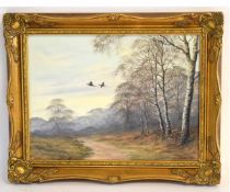 Caesar, signed and dated '79, oil on canvas, "Pheasants in flight over a winter wood", 29 x 39cms