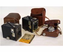 Group: Brownie 620D box cameras with cases, together with a Halina cased camera (3)