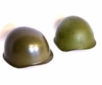 Mixed Lot: two green finished steel helmets, including Austrian M1 and Russian SSH40 examples,