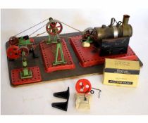 Mamod steam workshop comprising steam boiler, pulleys and workshop tools, all mounted on a
