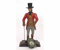 Painted base metal novelty timepiece modelled in the form of a clock seller wearing a top hat and