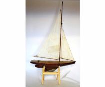 Early 20th century varnished timber pond yacht with typical weighted hull and fitted with mast, boom