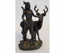 Resin model of a Red Indian alongside a reindeer, the model 33cms high