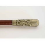 Base metal capped swagger stick bearing the regimental badge for the Argyll & Sutherland regiment,