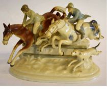 Show jumping group of two jumpers over a fence, the base impressed GDR, length 25cms