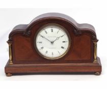 Mid-20th century mahogany and boxwood line inlaid mantel timepiece, the serpentine case with applied