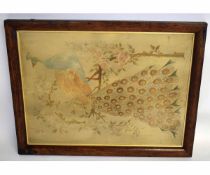 19th century silk work panel of a peacock in display amongst a flowering tree, 72cms x 52cms