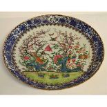 Large 19th century Cantonese famille rose charger decorated with exotic birds in a garden setting,