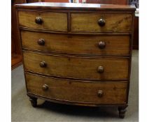 Victorian mahogany bow fronted two over three full width drawer chest with turned knob handles,