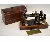 Walnut cased Sowitch decorative sewing machine