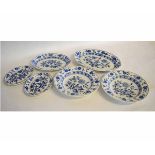 Group of late 19th century Wedgwood dishes with blue onion design, after Meissen, largest dish 34cms