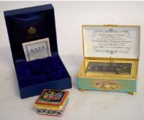 Halcyon Days boxed enamel pill box of square form with floral top, together with a further table top