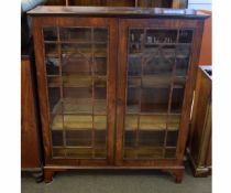 19th century rosewood and mahogany bookcase with two astragal glazed doors with arched detail,