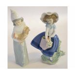 Two Lladro figures of young girls, one holding a chicken and the other holding a bouquet of flowers,