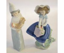 Two Lladro figures of young girls, one holding a chicken and the other holding a bouquet of flowers,