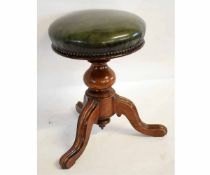 Victorian walnut adjustable piano stool with bulbous turned column and a tripod base with a green