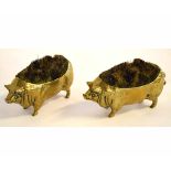 Pair of brass pig formed pin cushions, each 10cms long