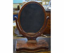 Victorian mahogany dressing table mirror with oval mirror and scrolling supports, with serpentine