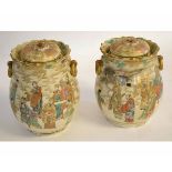 Pair of decorative Satsuma lidded vases with gilded ringlet side handles, decorated with