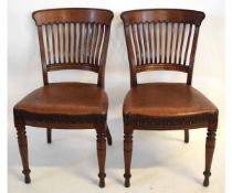 Set of four Edwardian mahogany dining chairs with flat backs and brown rexine upholstered seats on