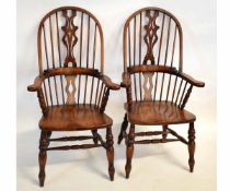 Pair of modern pine high back Windsor armchairs with pierced splat back and hard seat, on turned