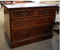 Edwardian mahogany and satinwood inlaid two over two full width drawer chest with brass swing