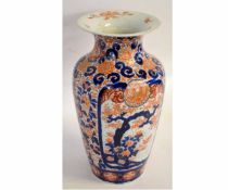 Large 19th century Imari decorated vase with flared neck with typical rust and blue floral