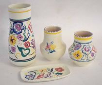 Group of Poole pottery wares including three baluster vases, 23cms, 13cms and 13cms, all floral