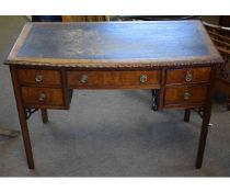 Edwardian mahogany bow fronted desk fitted with five drawers with ringlet handles, with inset