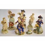 Six Continental porcelain figurines and a small bud vase