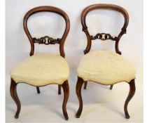 Set of four Victorian balloon back dining chairs with carved rail with cream upholstered seats and