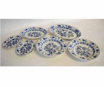 Group of late 19th century Wedgwood dishes with blue onion design, after Meissen, largest dish 34cms