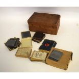 Teak framed box containing a quantity of assorted glass slides